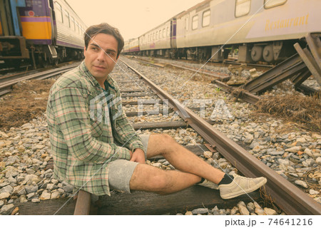 Handsome Persian tourist man at the railway station in Bangkok, Thailand Handsome Persian tourist man at the railway station in Bangkok, Thailand 74641216