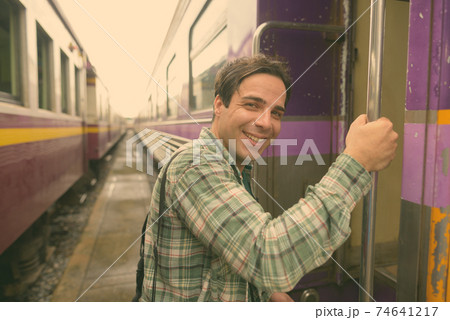 Handsome Persian tourist man at the railway station in Bangkok, Thailand Handsome Persian tourist man at the railway station in Bangkok, Thailand 74641217