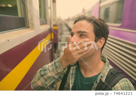 Handsome Persian tourist man at the railway station in Bangkok, Thailand Handsome Persian tourist man at the railway station in Bangkok, Thailand 74641221