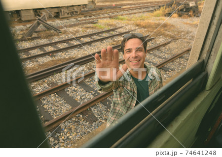 Handsome Persian tourist man at the railway station in Bangkok, Thailand 74641248