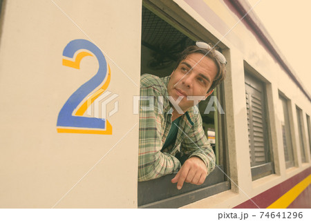 Handsome Persian tourist man at the railway station in Bangkok, Thailand Handsome Persian tourist man at the railway station in Bangkok, Thailand 74641296
