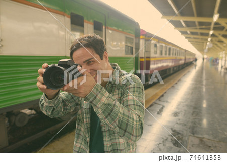 Handsome Persian tourist man at the railway station in Bangkok, Thailand 74641353