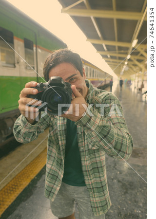 Handsome Persian tourist man at the railway station in Bangkok, Thailand Handsome Persian tourist man at the railway station in Bangkok, Thailand 74641354