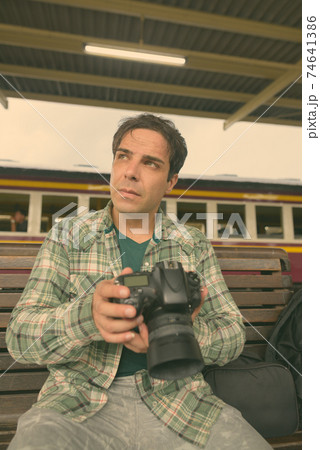 Handsome Persian tourist man at the railway station in Bangkok, Thailand 74641386