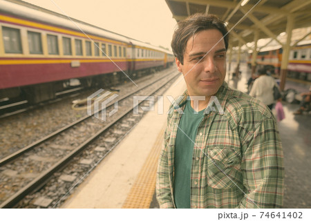 Handsome Persian tourist man at the railway station in Bangkok, Thailand Handsome Persian tourist man at the railway station in Bangkok, Thailand 74641402