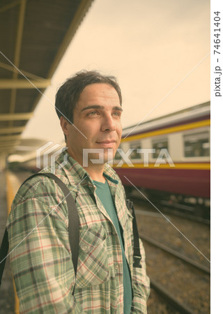 Handsome Persian tourist man at the railway station in Bangkok, Thailand 74641404
