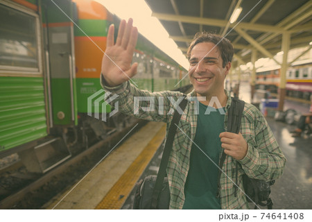 Handsome Persian tourist man at the railway station in Bangkok, Thailand 74641408
