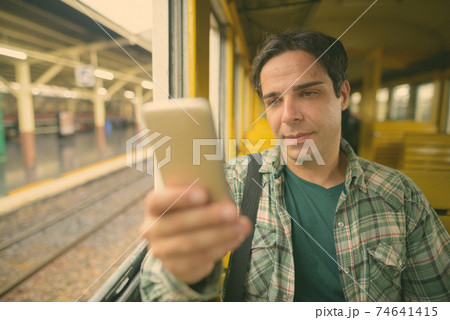 Handsome Persian tourist man at the railway station in Bangkok, Thailand Handsome Persian tourist man at the railway station in Bangkok, Thailand 74641415