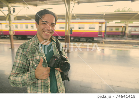 Handsome Persian tourist man at the railway station in Bangkok, Thailand Handsome Persian tourist man at the railway station in Bangkok, Thailand 74641419