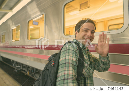 Handsome Persian tourist man at the railway station in Bangkok, Thailand 74641424