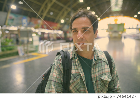 Handsome Persian tourist man at the railway station in Bangkok, Thailand Handsome Persian tourist man at the railway station in Bangkok, Thailand 74641427