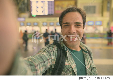 Handsome Persian tourist man at the railway station in Bangkok, Thailand 74641429