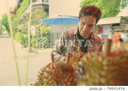 Handsome Persian tourist man exploring the city of Bangkok, Thailand Handsome Persian tourist man exploring the city of Bangkok, Thailand 74641454