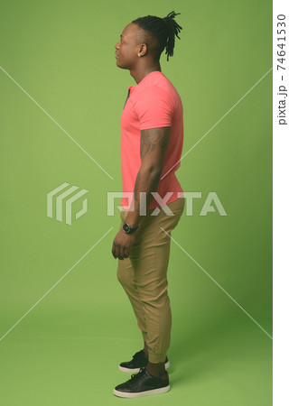 Young handsome African man from Kenya against green background 74641530
