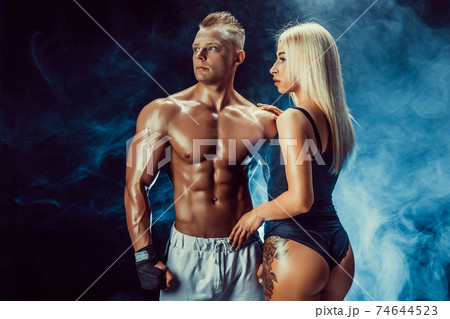 Attractive couple, a slim blonde female and handsome shirtless g 74644523