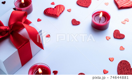 Valentines day heart, romantic gift box, red love candle on white background. Sainte Valentine, mothers day, birthday greeting cards, invitation, celebration concept. Valentines day heart, romantic gift box, red love candle on white background. Sainte Valentine, mothers day, birthday greeting cards, invitation, celebration concept. 74644881