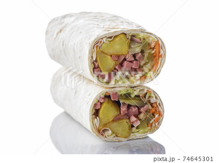 Doner kebab, shawarma with rustic potatoes and cabbage on a wooden textured background 74645301