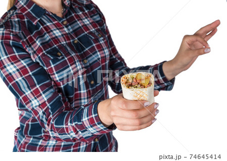 Female hands hold doner kebab, shawarma Female hands hold doner kebab, shawarma 74645414