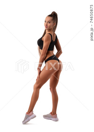 Beauty fit woman in sport underwear look at camera 74650875