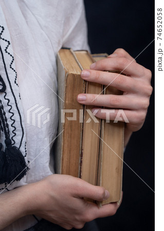 Closeup of Hands Holding A Stack Of Books. Concept of self-education, self-development 74652058