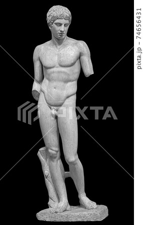 Ancient white marble full length sculpture of naked young man. Antique classic statue of youngster isolated on black. Stone figure of teenager Ancient white marble full length sculpture of naked young man. Antique classic statue of youngster isolated on black. Stone figure of teenager 74656431