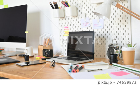 Workspace computer with graphic designer table in real studio. Workspace computer with graphic designer table in real studio. 74659873