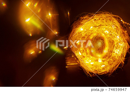 Easter background with golden egg and magic lights around Easter background with golden egg and magic lights around 74659947