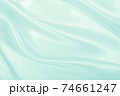 Smooth elegant blue silk or satin luxury cloth texture as abstract background. Luxurious background design 74661247