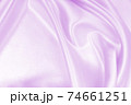 Smooth elegant lilac silk or satin texture as wedding background. Luxurious background design 74661251
