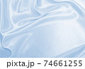 Smooth elegant blue silk or satin luxury cloth texture as abstract background. Luxurious background design 74661255