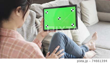 woman look green screen tablet woman look green screen tablet 74661394