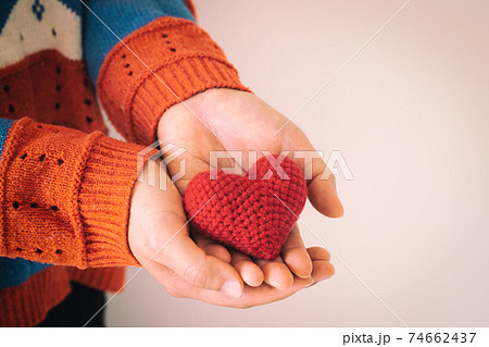Women wear knit shirt hand holding red heart. Concept of love, hope, happy valentine, healthcare,organ donation,insurance, medical, World heart day, National Organ Donor day,World mental health day. 74662437