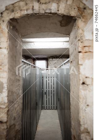 a hallway inside of a basement between the units 74662445