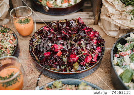 Salad of beetroots in bowl on a wooden table 74663116
