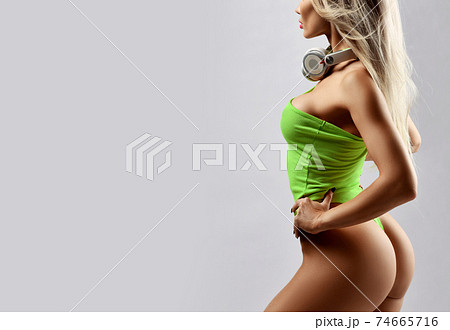 Portrait of sexy slim woman in yellow swimsuit and 74665716