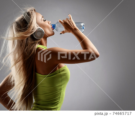 Portrait of sexy athletic woman in yellow swimsuit Portrait of sexy athletic woman in yellow swimsuit 74665717