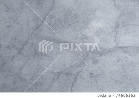 Wet white paper glued to the wall. Wet paper texture. Wet white paper glued to the wall. Wet paper texture. 74666362