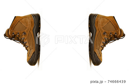 Hiking shoes and a white background, Sturdy hiking boots Hiking shoes and a white background, Sturdy hiking boots 74666439