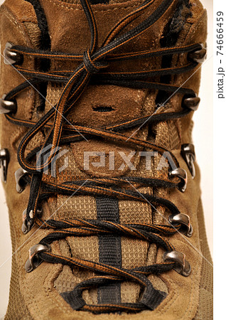 Hiking shoes and a white background, Sturdy hiking boots Hiking shoes and a white background, Sturdy hiking boots 74666459
