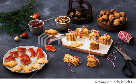 Baking with love for Merry Christmas. Baking Christmas cookies. Dark background table. 74667068