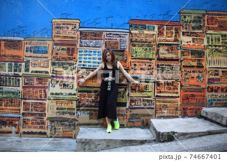 girl with the beautiful street view in graham street, central, hong kong girl with the beautiful street view in graham street, central, hong kong 74667401
