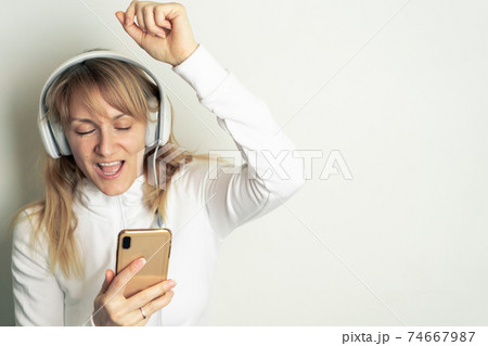 Woman enjoying music with headphones Woman enjoying music with headphones 74667987