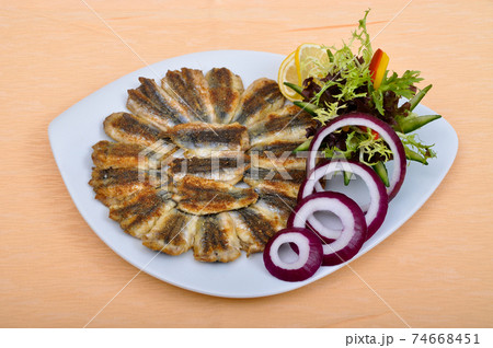 Delicious and beautiful fried hamsi fish and salads 74668451