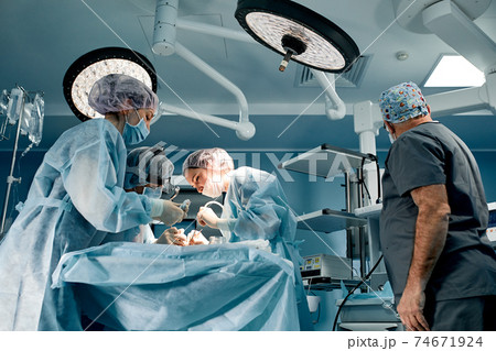 A team of surgeons is fighting for life, for a real operation, for real emotions. The intensive care team is fighting for the life of the patient. Saving life, the struggle for life A team of surgeons is fighting for life, for a real operation, for real emotions. The intensive care team is fighting for the life of the patient. Saving life, the struggle for life 74671924