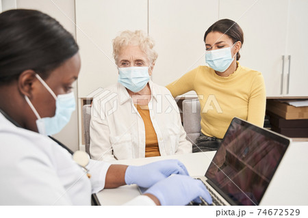 Doctor hearing about patient problems with health 74672529