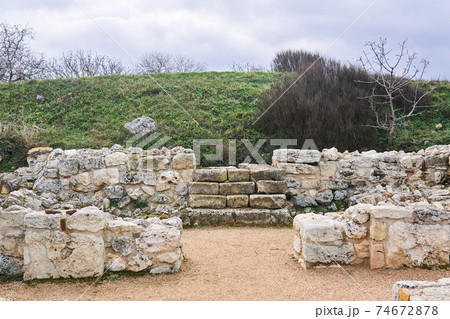 steps in the ruins of an antique house lead to an unexcavated part of it under the hill steps in the ruins of an antique house lead to an unexcavated part of it under the hill 74672878