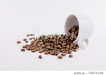 white cup of coffee with sprinkled coffee beans white cup of coffee with sprinkled coffee beans 74674100
