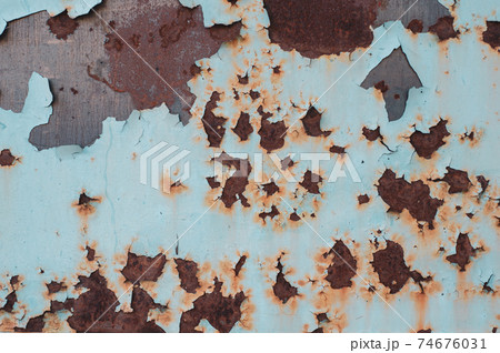 Bright colorful background from rusty metal with old shabby cracked paint, atmospheric impact, outdoors, horizontal photo. 74676031