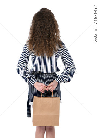 Child with a packet isolated on white 74676437