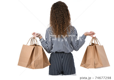 Child with a packet isolated on white 74677298